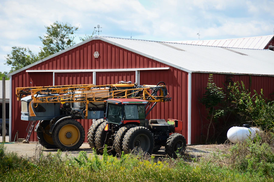 Tractor in front of a farm barn — UK agricultural operation